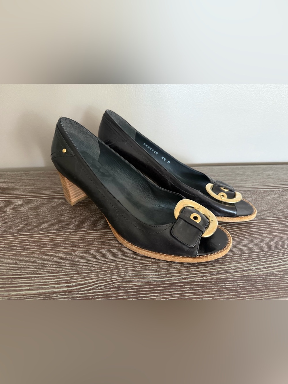 Stuart Weitzman black leather heels with gold hardware